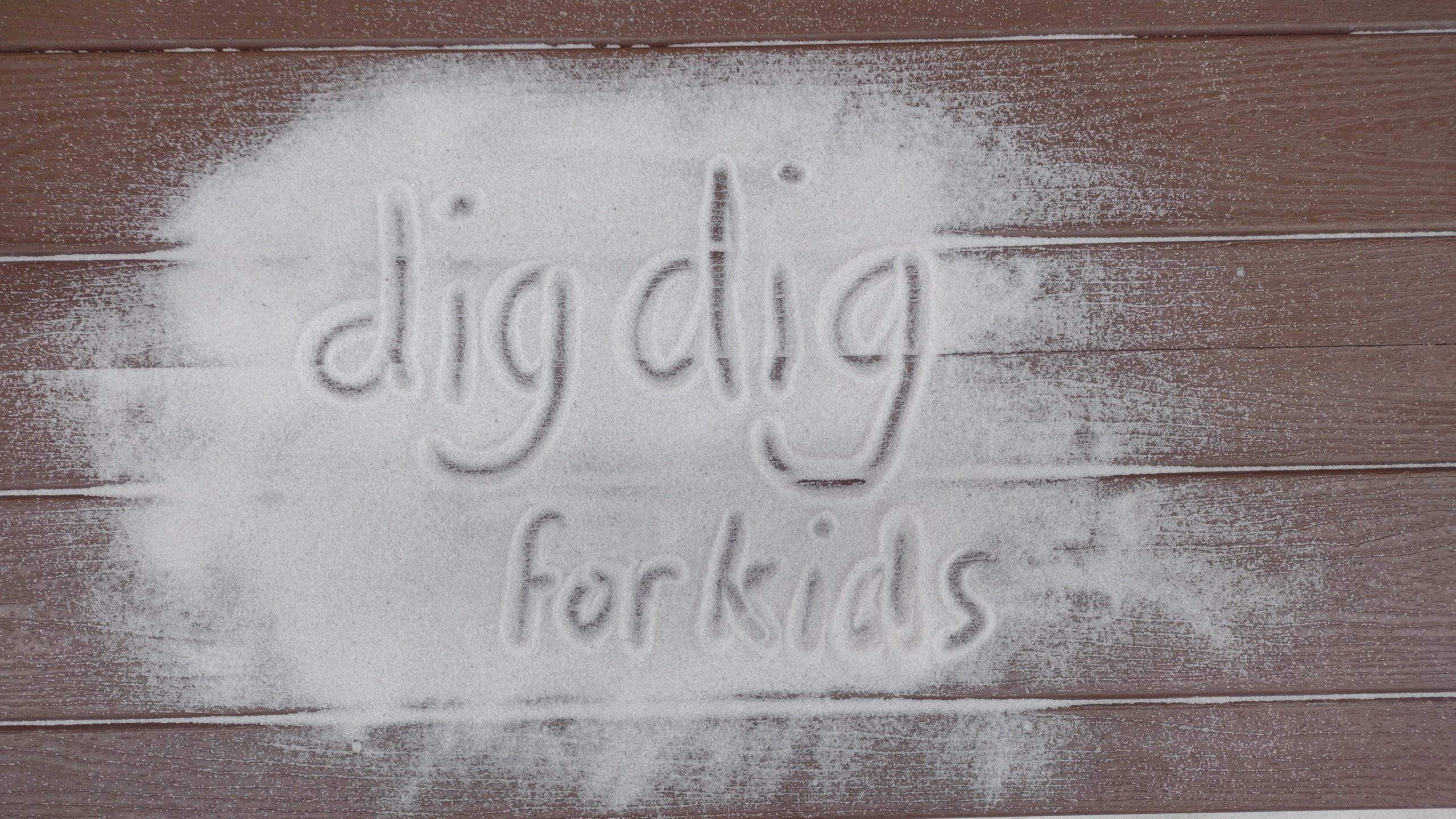 dig dig for kids written in the sand